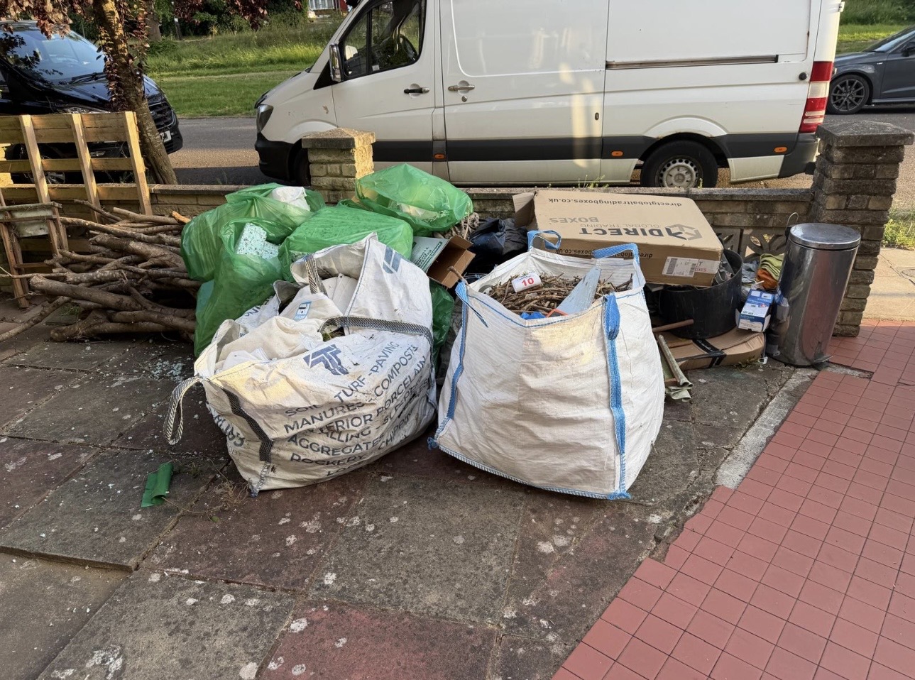Garden waste, branches and rubble bags ready for collection