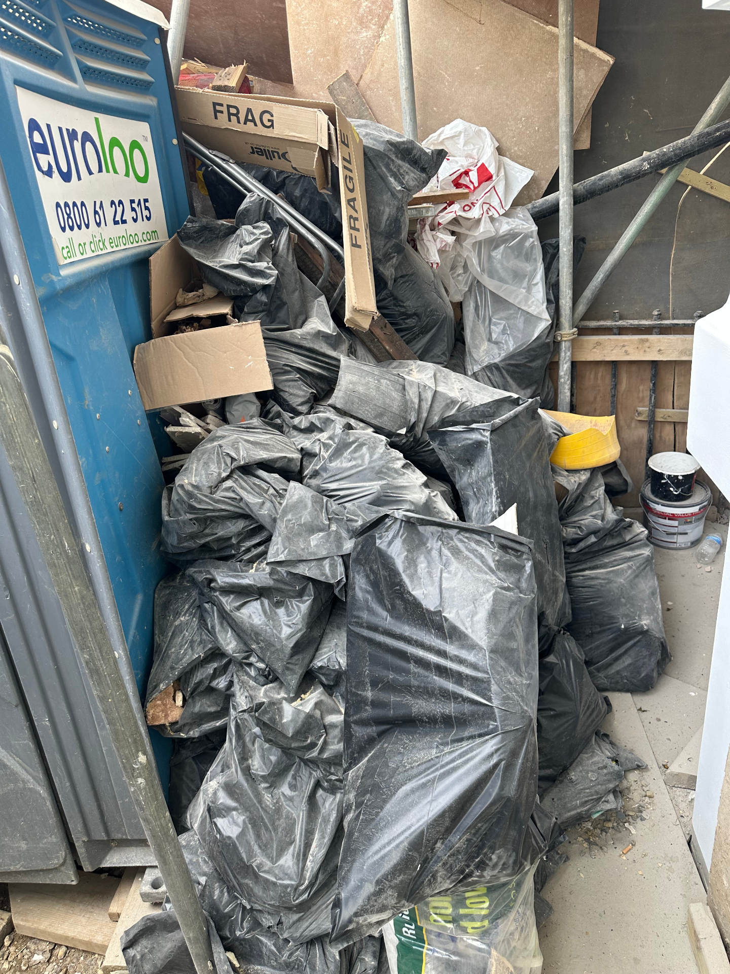 Builders rubble and bagged construction waste